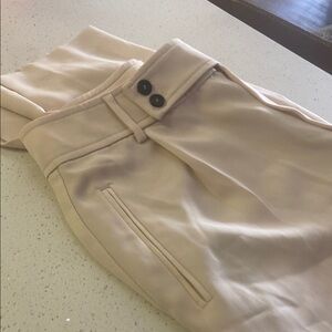 Ming Cream Trousers with small pleats and cut leg at bottom